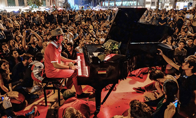 A man plays piano for the protesters in Taksim Square in Istanbul.