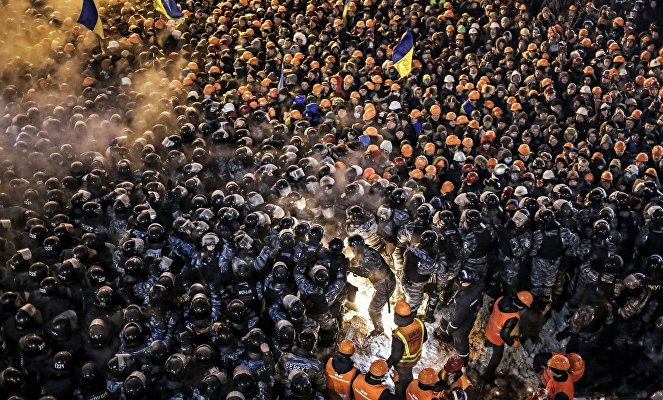 Berkut special foces and housing and utilities staff during a storm of the camp of the supporters of Ukraine's integration with the EU on Maidan Square in Kiev.