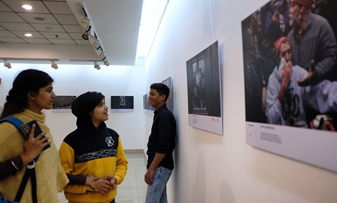 Visitors attend the Stenin Photo Contest exhibition opening ceremony, in New Delhi, India. 